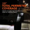 Truck rock lights projecting a 180-degree wide beam onto a paved road at night, showcasing total perimeter coverage.